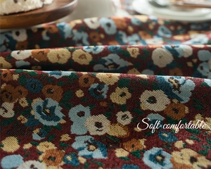 Close-up of retro floral jacquard fabric with detailed soft texture and intricate patterns