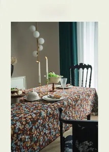 Close-up of floral jacquard tablecloth with colorful vintage embroidery and rich texture
