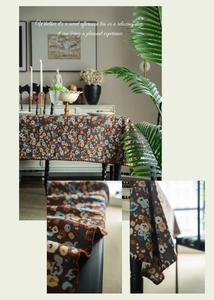 Close-up of vintage floral jacquard tablecloth with scalloped edges and thick fabric texture