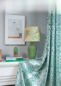 Detail of green water drop jacquard curtain with embossed texture and premium fabric drape