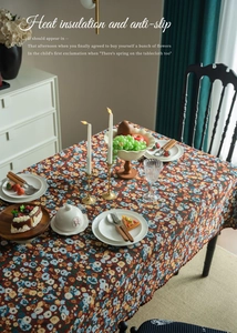 Detail of vintage floral tablecloth featuring heat insulation and anti-slip textures
