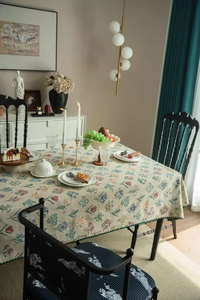 Close-up of French vintage floral jacquard tablecloth with colorful botanical patterns