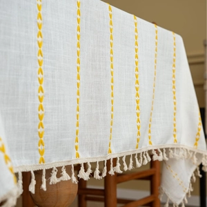 French cream style white tablecloth with yellow embroidery and beige tassels
