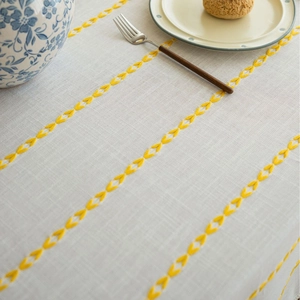 French cream style tablecloth with yellow embroidery and elegant beige tassels