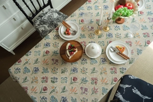 Close-up of French vintage floral jacquard tablecloth with elegant herbal patterns