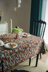 Close-up of vintage floral embroidered tablecloth with intricate jacquard texture details