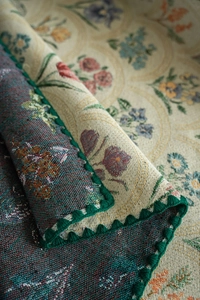 Close-up of French vintage woven floral tablecloth with intricate jacquard details