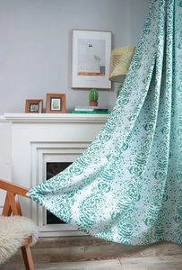 Close-up of semi-blackout curtains with classical blue and green jacquard patterns