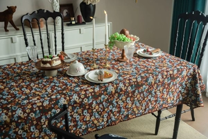 Detail of French vintage floral tablecloth with oil painting style and rich embroidery