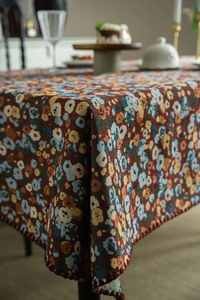 Close-up of retro floral jacquard tablecloth fabric with elegant crochet embroidery edge