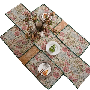 Floral jacquard table runner and placemat set with vintage red lily and green border