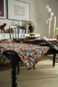 Detailed macro view of French vintage floral jacquard tablecloth with textured embroidery