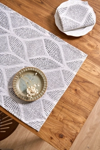 Detail of gray geometric pattern on cotton linen napkins with minimalist wheat design