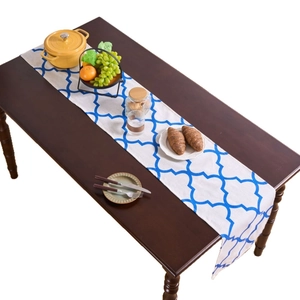 Nordic style blue geometric table runner on dark wood dining table for home decor