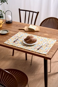 Detailed view of yellow floral pattern on a rectangle cotton linen placemat