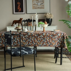 French vintage floral tablecloth with matching animal print chair in luxury dining setting