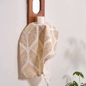 Modern fabric napkin with brown leaf pattern on ivory base for home table decoration