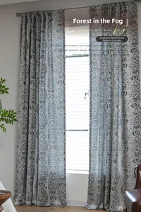 Detailed view of gray and white jacquard curtains with water drop pattern in modern interior