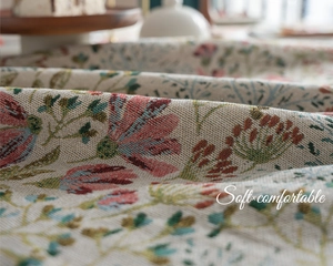 Detail of French vintage floral jacquard tablecloth fabric with retro woven texture