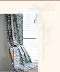 Detailed view of grey and white jacquard fabric curtain with retro droplet patterns