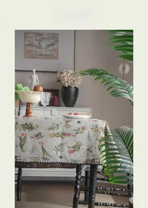 Macro detail of French vintage jacquard tablecloth with floral and butterfly patterns