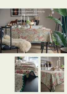 Detail of French vintage floral tablecloth with pink roses and green scalloped crochet edge
