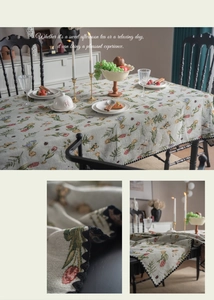 Close-up of French vintage floral jacquard tablecloth with elegant wavy edge details