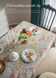 Close-up of French retro floral tablecloth with intricate heat-resistant jacquard texture