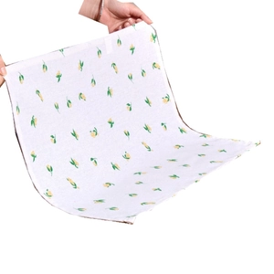 Nordic style fabric napkin with yellow lemon floral print on a white background