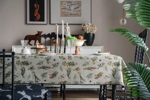 Close-up of floral jacquard tablecloth with tulip embroidery and wave piping edges