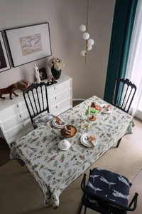 Close-up of vintage floral embroidery and butterfly jacquard on rectangular tablecloth