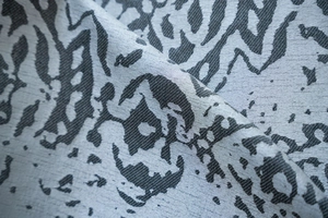 Macro shot of grey jacquard curtain fabric with abstract drop pattern texture
