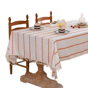 Minimalist beige rectangular cotton linen tablecloth with orange stripes and white fringe