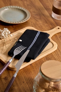 Nordic style black woven napkin with white stripes and elegant wooden handled cutlery