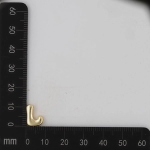Macro detail of 18k gold L-shaped bubble letter pendant with 11mm scale measurement