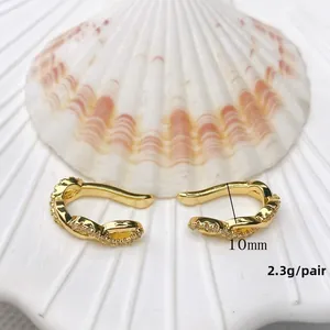 Detail of 10mm double-layered C-shaped gold-plated ear clips with sparkling zircons