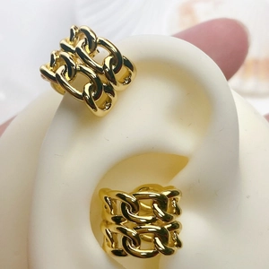Detailed macro view of triple layered Cuban chain ear clips in 18K gold plated brass finish