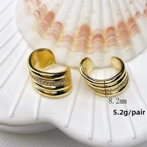 Detail of 18K gold plated S925 silver double C-shape ear cuff with clear cubic zirconia