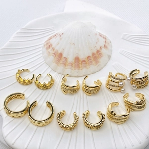 Elegant gold ear cuff set with pearls and zircon on white shell, non-piercing jewelry