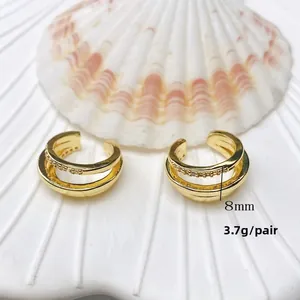 Detail view of double-layer gold ear clip with zircons and 8mm width measurements