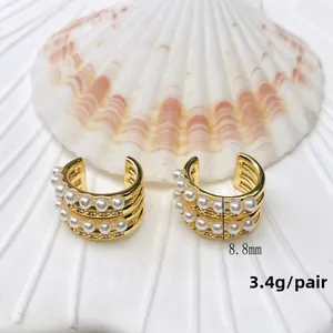 Detailed close-up of double-layer C-shape gold ear cuffs with pearls and size 8.8mm marking