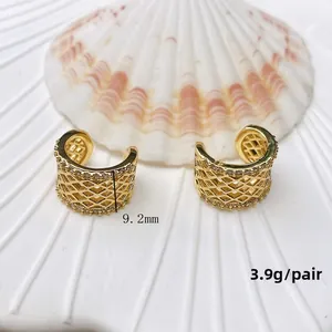 Detail view of U-shaped gold cuff earrings with mesh grid and cubic zirconia (3.9g/pair)