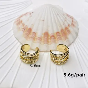 Detail of gold U-shaped ear cuff with zircon inlay and dimensions 8.6mm and 5.6g weight