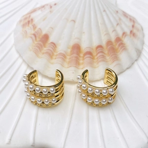 Elegant double-layered C-shaped gold ear clips with white pearls and fine crystals