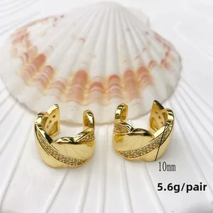 Detail view of U-shaped gold ear cuffs with crystals, measuring 10mm and weighing 5.6g