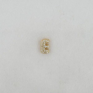Macro shot of gold letter E balloon pendant charm with sparkling cubic zirconia inlay