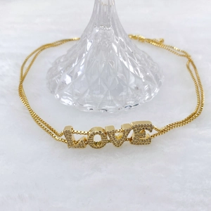 Double-layer gold plated box chain bracelet featuring a sparkling diamond-set LOVE pendant