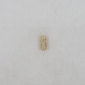 Detailed macro view of a gold balloon-style alphabet pendant with pave cubic zirconia