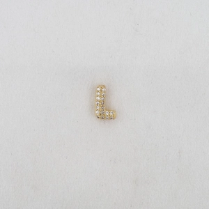 Macro detail of puffy bubble letter L pendant with pavé cubic zirconia in gold plating