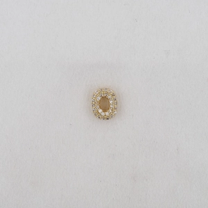 Detailed view of gold-plated letter O pendant featuring pave-set sparkling zircon stones